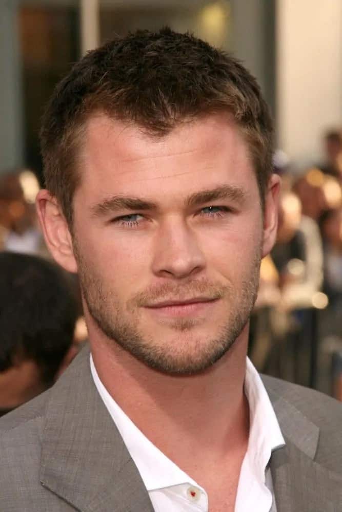 Chris Hemsworth sported a classic spiky crew cut hairstyle with his classic gray suit at the 2009 Los Angeles Premiere of 'Star Trek.