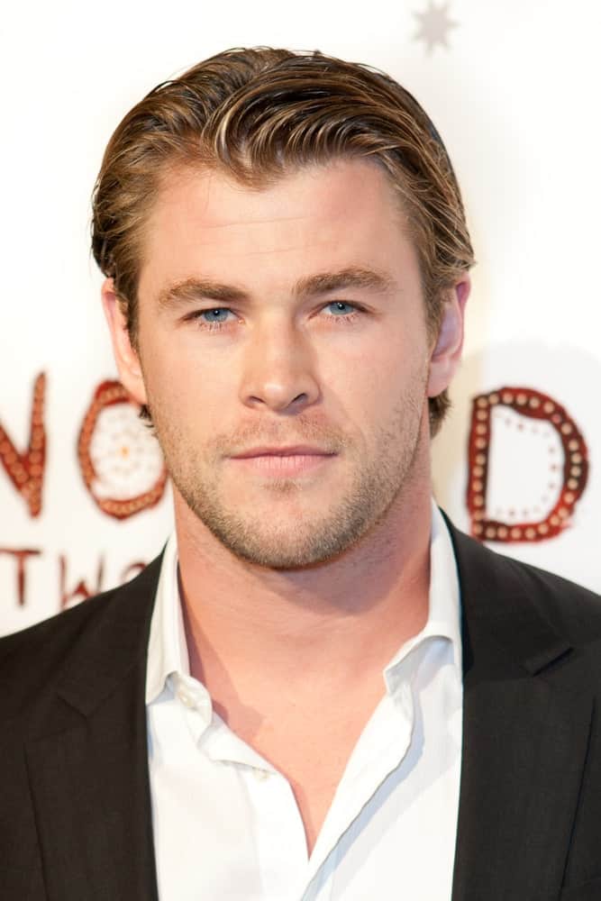 Australian actor Chris Hemsworth was at the Nomad Two Worlds Los Angeles debut gala at 59 Pier Studios West last February 22, 2011 in Santa Monica. He had a wet look to his slick side-parted hair complemented by his five o'clock shadow.