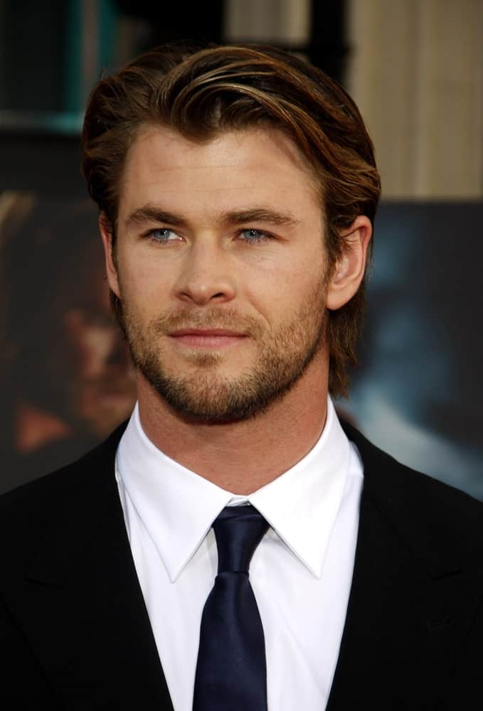 Last May 2, 2011, Chris Hemsworth was at the Los Angeles premiere of "Thor" held at the El Capitan Theater in Los Angeles. His hair was styled in a sophisticated side-swept style to match his trimmed beard.