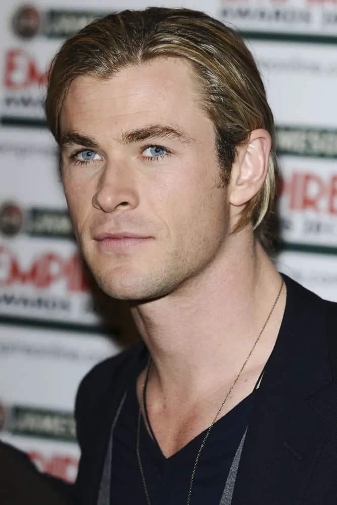 Chris Hemsworth was in the press room at the Empire Film Awards 2012. He was wearing a smart casual ensemble to pair his long side-swept hairstyle with highlights.