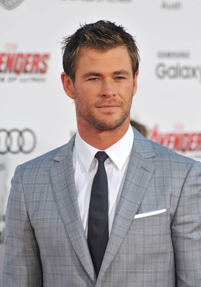 Last April 13, 2015, Chris Hemsworth atteneded the world premiere of his movie "Avengers: Age of Ultron" at the Dolby Theatre in Hollywood. His dapper detailed suit was paired with spiky and messy short crew cut hairstyle.
