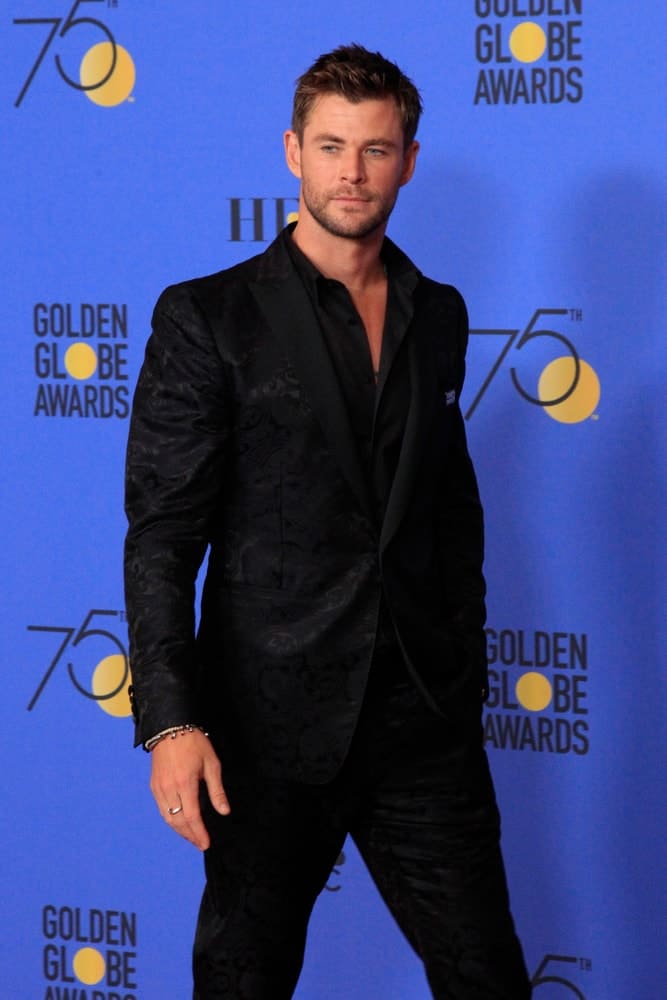 Chris Hemsworth was spotted at the 75th Golden Globes Press Room at Beverly Hilton Hotel last January 7, 2018 in Beverly Hills. He sported a fashion forward black suit paired with a short and spiky crew cut hairstyle.