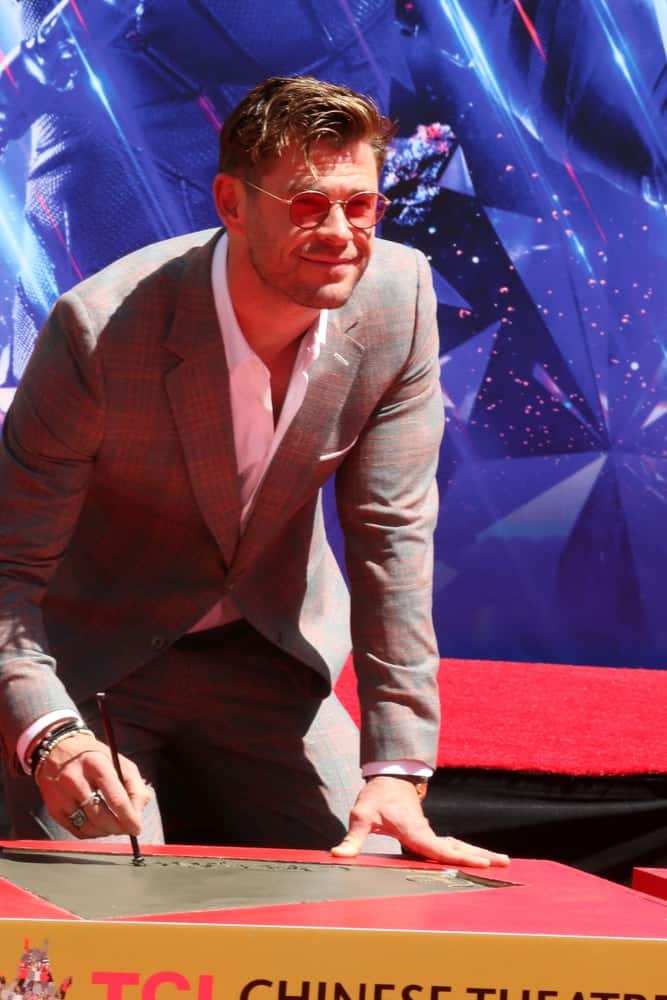 Chris Hemsworth was at the Avengers Cast Members Handprint Ceremony at the TCL Chinese Theater last April 23, 2019 in Los Angeles. He wore a patterned gray suit to match his dark brown side-swept fade hairstyle.