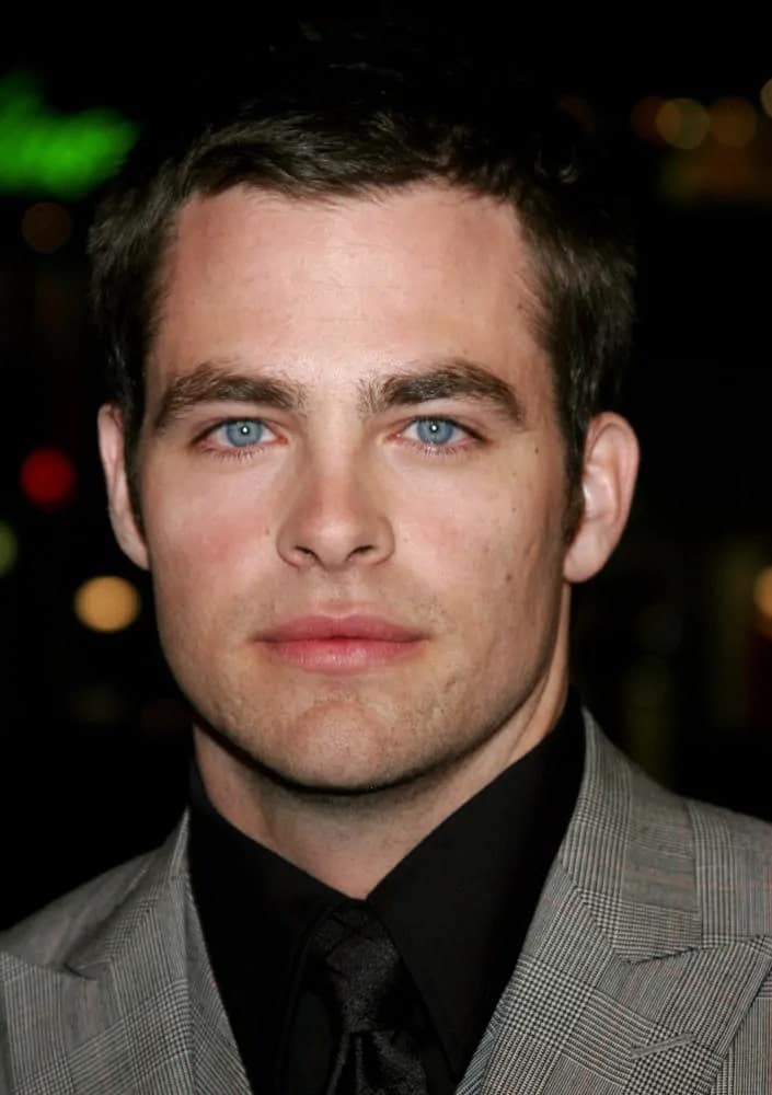 The talented actor, Chris Pine, wore a fashionable patterned gray suit and dyed his short crew cut hair black when he attended the 2007 world premiere of "Smokin' Aces" in Hollywood, CA.
