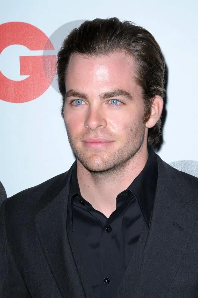 Chris Pine attended the 2008 GQ "Men of the Year" Party at Chateau Marmont Hotel, Los Angeles, CA. He opted for an all-black three-piece suit to go with his long brushed-back dark hair.