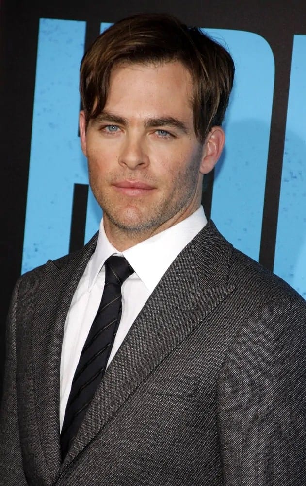 Chris Pine wore a dark brown undercut hairstyle with long side-swept bangs and five o'clock shadow to pair his classy gray suit at the Los Angeles 2014 premiere of "Horrible Bosses 2".