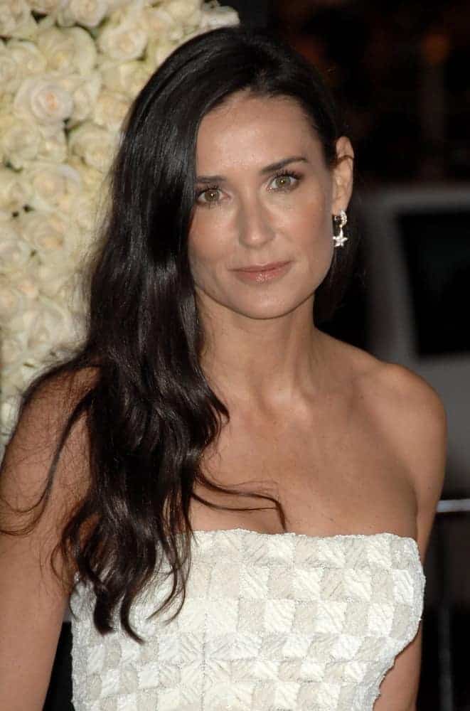 Demi Moore matched her simple but elegant dress with side-swept long hair with soft curls during world premiere of the movie "Valentine's Day" held at The Chinese Theater, February 8, 2010.
