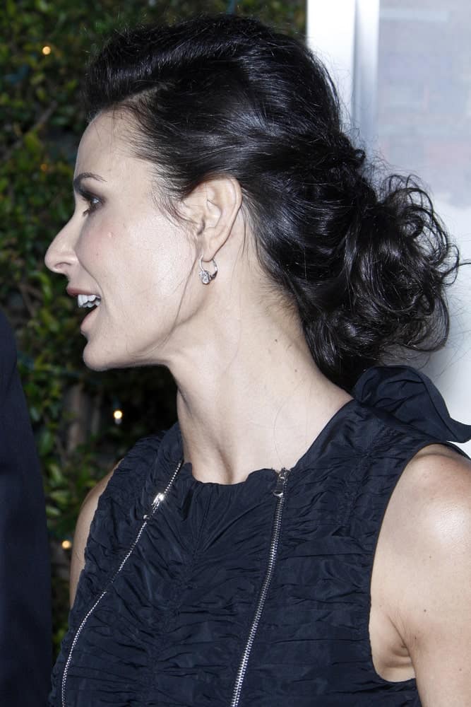 The actress sporting a glamorous updo hairstyle with a side braid and volumized slicked back on top. This was taken during the "No Strings" Premiere at Regency Village Theater on January 11, 2011.