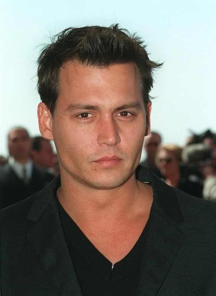 Fresh-faced Johnny Depp looked dashing in a short crew cut with a quiff that goes quite well with his clean-shave look during the 1997 Cannes Film Festival.
