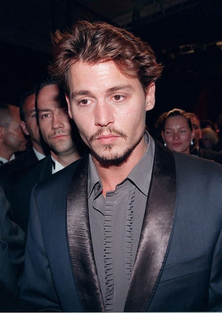 Last May 15, 1998, Actor Johnny Depp was at the Cannes Film Festival to promote his movie, "Fear and Loathing in Las Vegas." He wore a dapper blue suit to pair his short tousled hair.