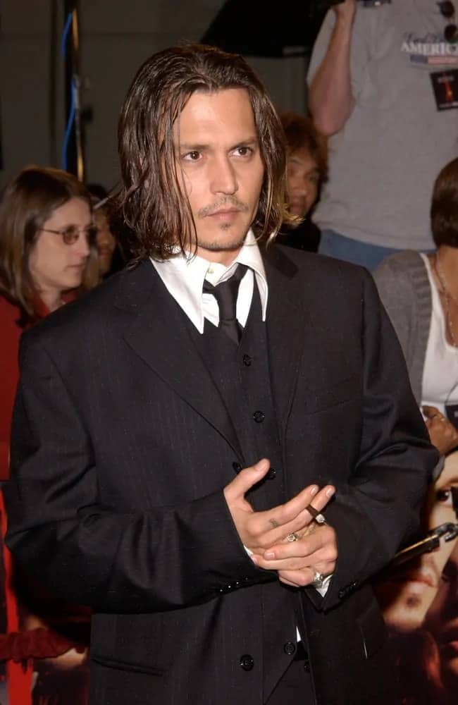 Johnny Depp sported this long hairstyle that is reminiscent of Nirvana at the Los Angeles premiere of his new movie From Hell in 2001.