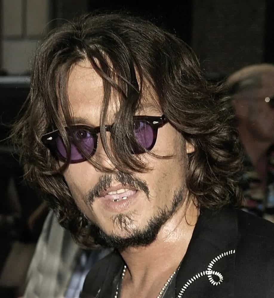 Johnny Depp went for a textured long and layered hairstyle at a talk show appearance for "The Late Show with David Letterman" held at The Ed Sullivan Theater in New York last July 27, 2006.