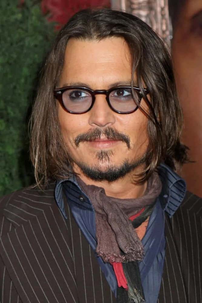Johnny Depp had his iconic and unique look with long wavy hair, colored sunglasses and some scarves during the New York premiere of "The Tourist" in 2010.
