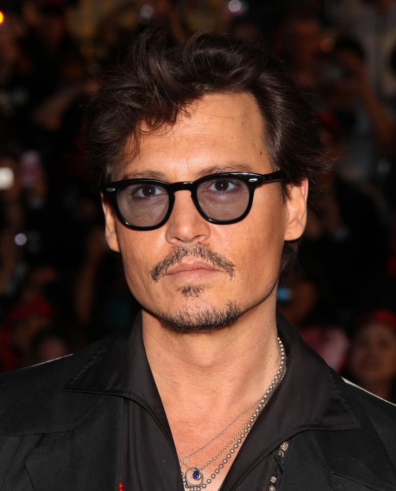 Johnny Depp was his usual rugged self at the "Pirates of the Caribbean: On Stranger Tides" World Premiere on May 7, 2011 in Anaheim. His short hair was tossed up and messy to a stylish finish.