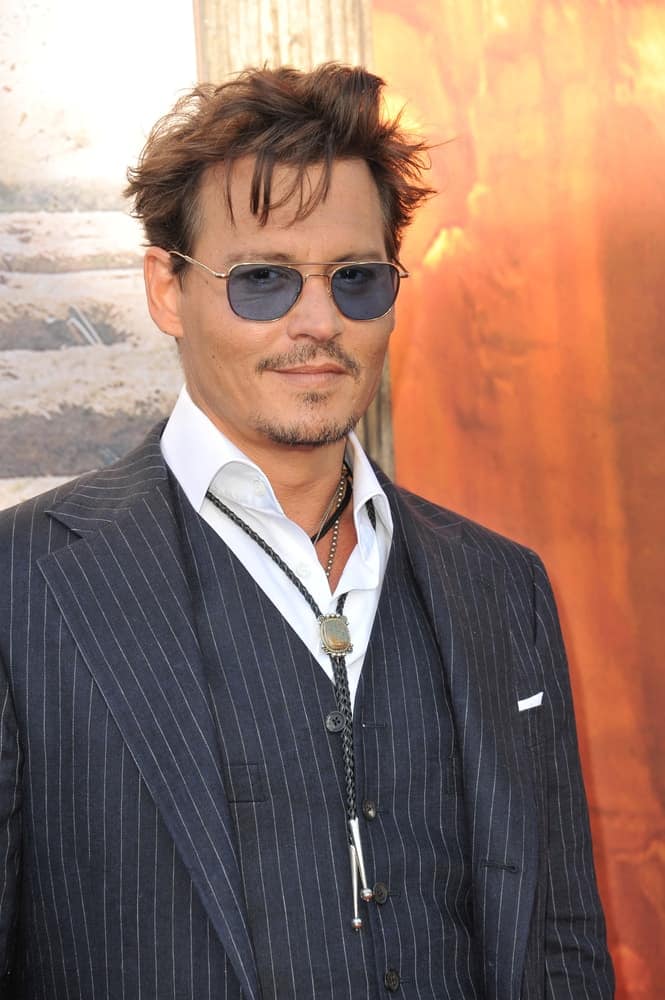 Last June 22, 2013, Johnny Depp attended the world premiere of his new movie "The Lone Ranger" at Disney California Adventure. He wore a pinstriped three-piece suit and his messy hair was dyed reddish brown.