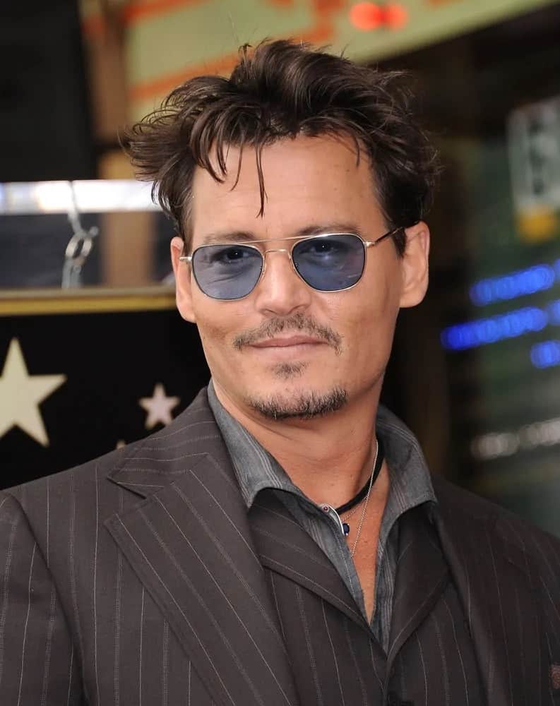 The actor Johnny Depp showed up with his stylish messy hairstyle as he arrived to the Walk of Fame Honors Jerry Bruckheimer on June 23, 2013 in Hollywood, CA.