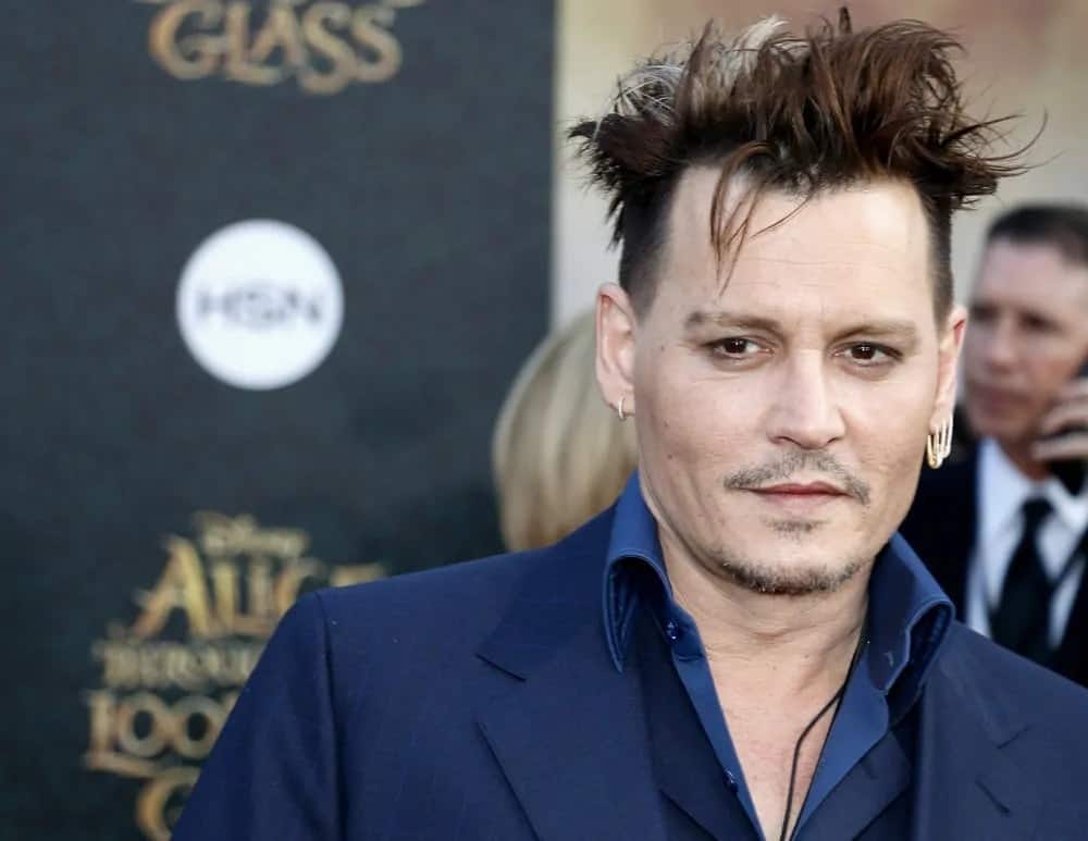 Johnny Depp's unique hairstyle had a lighter shade of hair color. It goes well with his for his tousled undercut hairstyle during the Los Angeles premiere of 'Alice Through The Looking Glass' held at the El Capitan Theater in Hollywood last May 23, 2016.