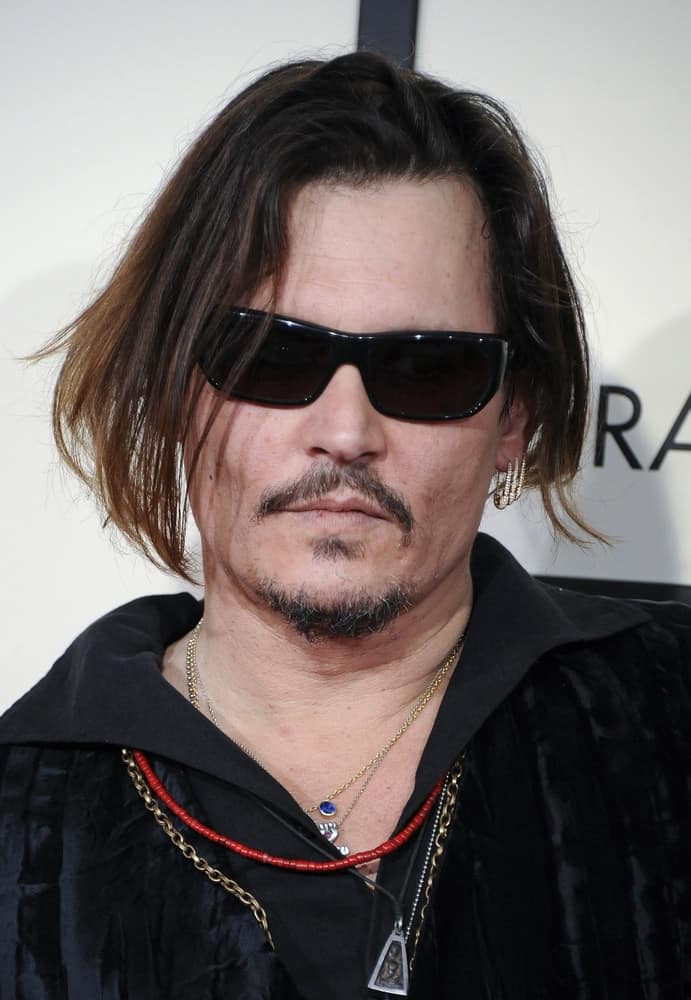 Johnny Depp attended the 58th Grammy Awards held at the Staples Center in Los Angeles,  last February 15, 2016. His long undercut hair was highlighted and tousled loose that is a nice pairing for his facial hair.