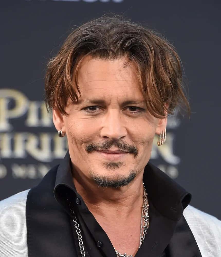 Johnny Depp had messy and wavy curtain bangs with highlights during the US premiere of "Pirates of the Caribbean: Dead Men Tell No Tales" in 2017.