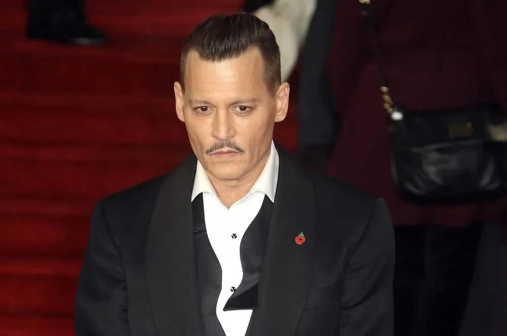 Johnny Depp sported a vintage classic look with this slicked back undercut hairstyle at the London premiere of his film "Murder on the Orient Express" in 2017.