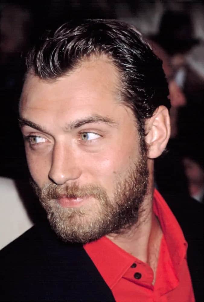 Jude Law looked ruggedly handsome with his beard and dyed black hair slicked back during the New York premiere of "Road to Perdition" in 2002.