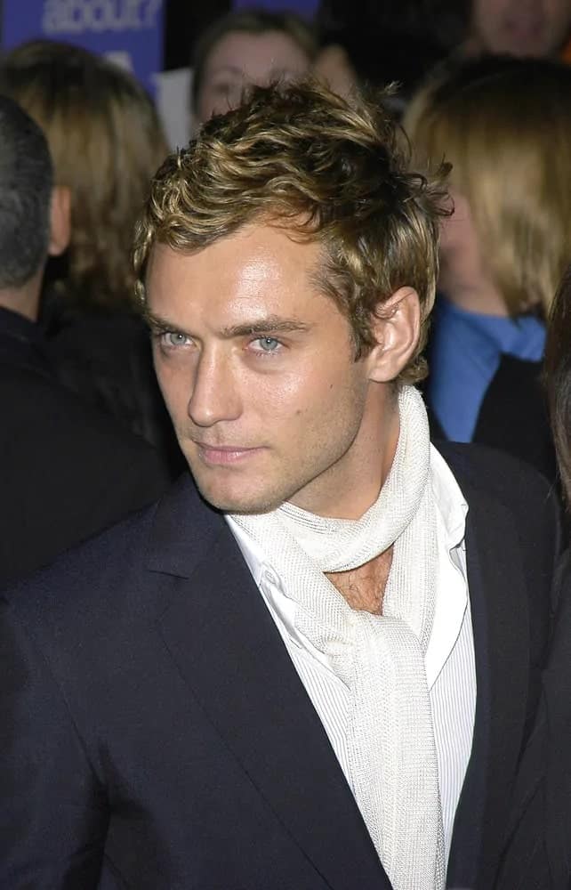 Jude Law looked classy and androgynous with his eye-catching curly blond hair with a tousled finish during the New York premiere of "Alfie" at Ziegfeld Theater in 2004.