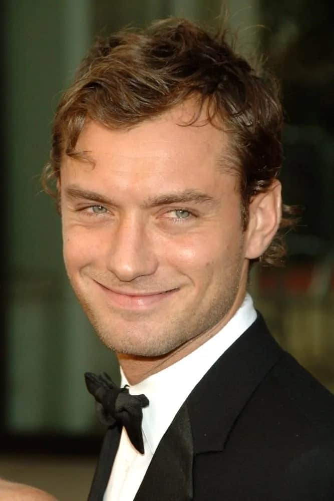 Jude Law paired his tousled blonde curls with a sheepish smile at the Metropolitan Opera Opening Night Gala of Madam Butterfly, Metropolitan Opera House at Lincoln Center, New York, NY in 2006.
