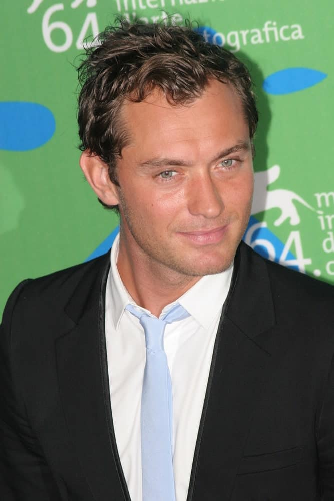 Jude Law's short dark hair was tossed into a wavy and spiky style when he attended the Sleuth photocall during Day 2 of the 64th Annual Venice Film Festival last August 30, 2007 in Venice, Italy.