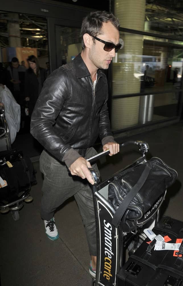 Actor Jude Law was seen at LAX last February 26, 2010 in Los Angeles, California wearing a casual leather jacket that complements his brushed up raven hair.
