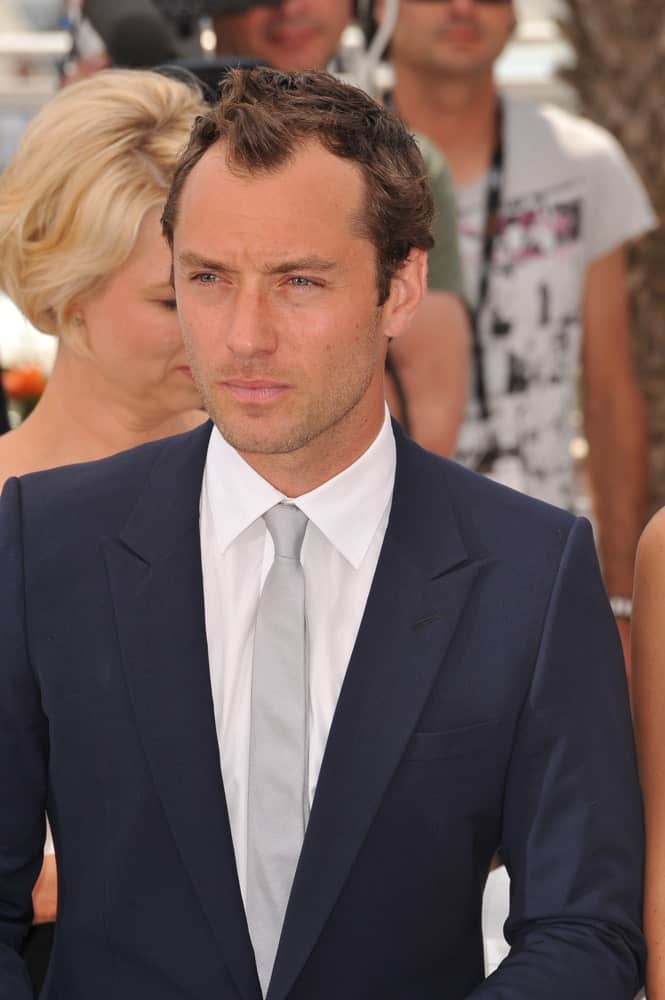 Jude Law's short crew cut hair with highlights were styled into waves and spikes at the photocall for The Jury at the 64th Festival de Cannes last May 11, 2011 in Cannes, France.