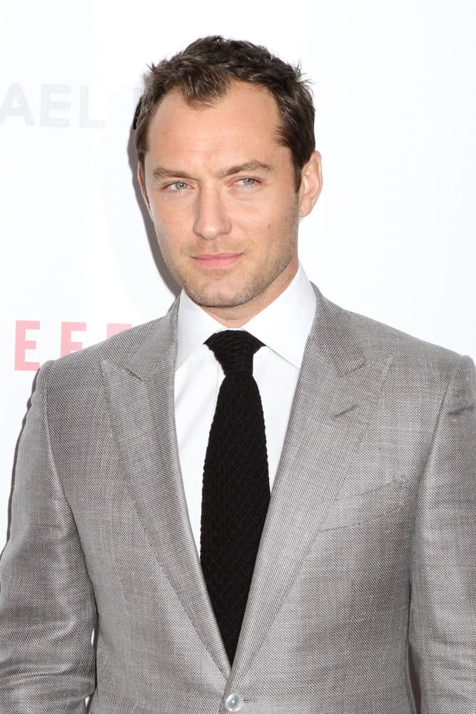 Jude Law attended the premiere of "Side Effects" at AMC Lincoln Square Theater last January 31, 2013 in New York City. He wore a smart gray suit with his short and slick hair complemented with some highlights.
