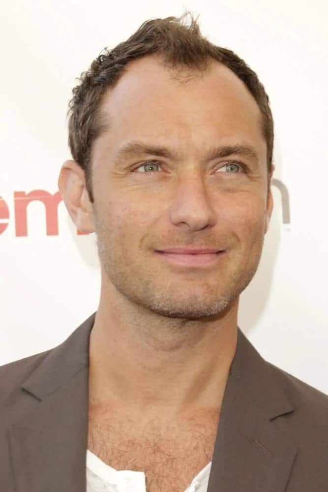 Jude Law wore a very short hair and five o'clock shadow to emphasize his brilliant green eyes at the 20th Century Fox 2015 Presentation at Cinemacon at the Caesar's Palace on in Las Vegas, CA.