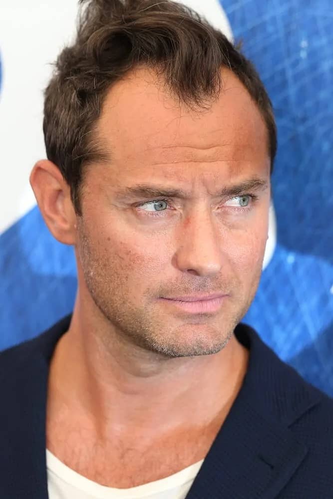Jude Law showcased a stylish tossed fade hairstyle when he attended the 2016 photocall of 'The Young Pope' at the 73rd Venice Film Festival in Venice, Italy.