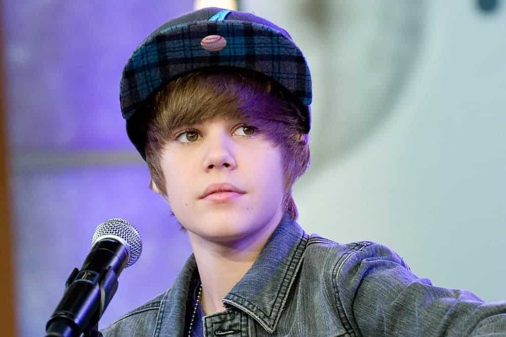 Young Justin Bieber popped into the music scene with this signature hairstyle and can be seen here performing for Good Morning America GMA Concert at the GMA Times Square Studio, New York, NY in 2009.