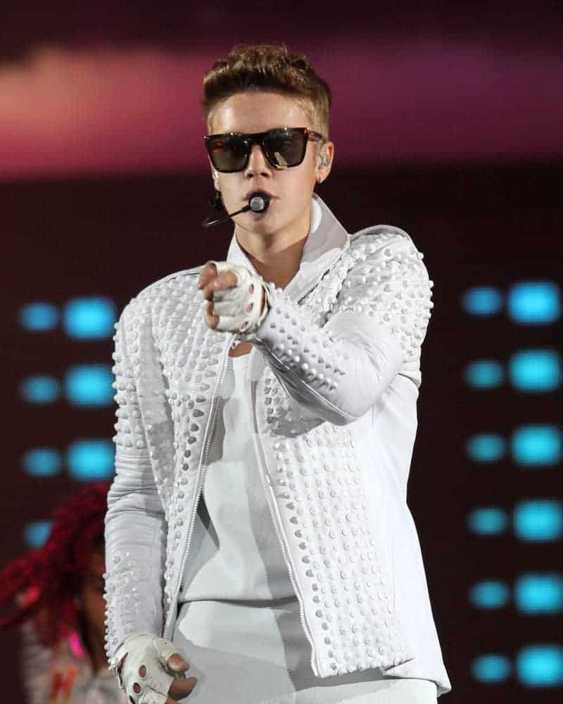 Justin Bieber performing at the Prudential Center on July 30, 2013 in New Jersey, sporting a slicked back 'do.