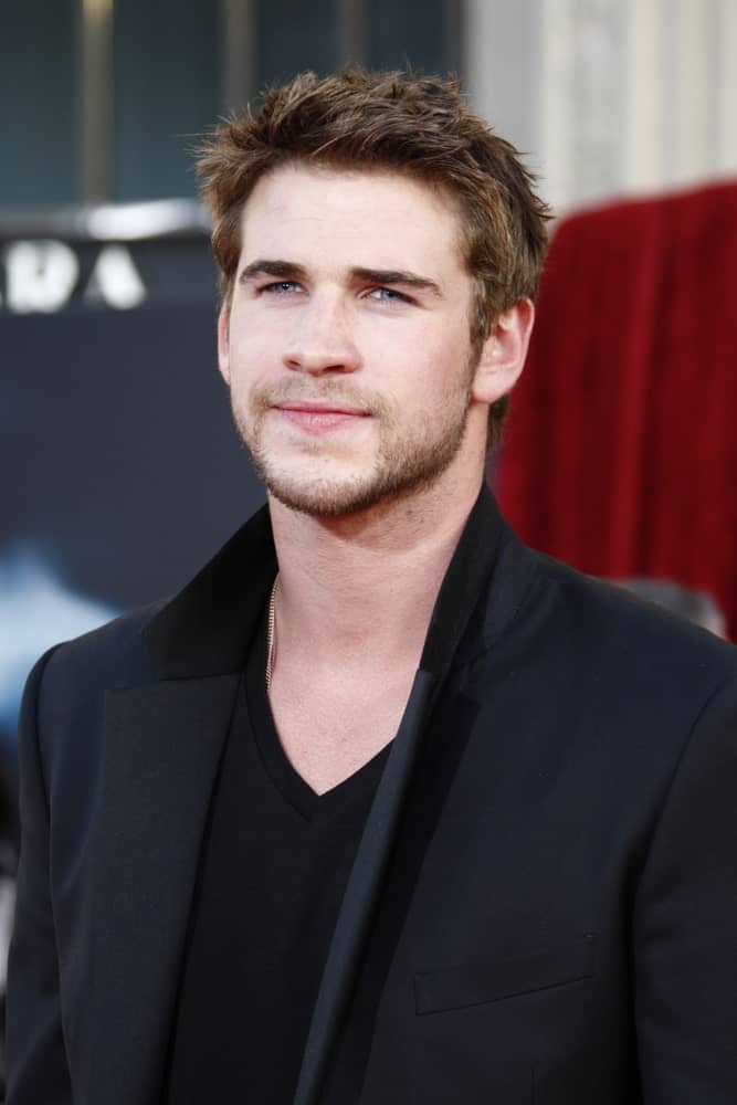 Liam Hemsworth sported a spiky hairstyle with his medium brown locks during the premiere of Thor at the El Capitan Theater, Los Angeles, California on May 2, 2011.