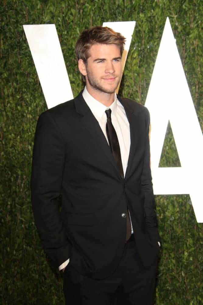 Liam Hemsworth cast a spell with his golden brown side-parted 'do during the Vanity Fair Oscar Party at Sunset Tower on February 26, 2012 in West Hollywood, California.