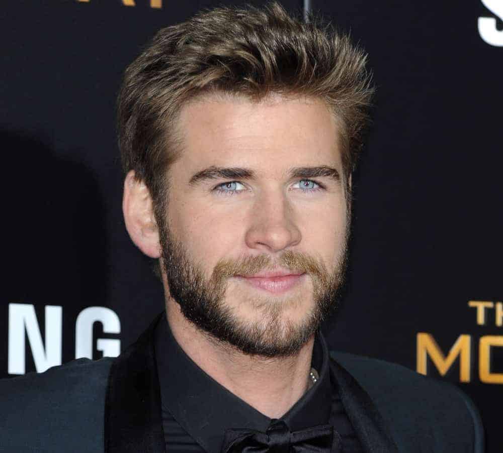 Liam Hemsworth appeared with short spiky hairstyle and a full beard at "The Hunger Games: Mockingjay Part 1" photocall for the 67th Annual Cannes Film Festival in 2014.