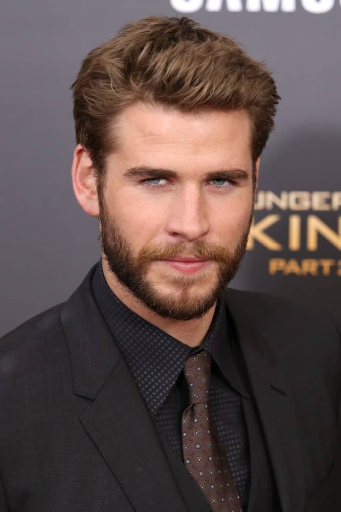 The Australian actor looking all gorgeous and dreamy with his semi-spiky hair that goes perfectly with his tight beard. This was taken during the premiere of "The Hunger Games: Mockingjay - Part 2" on November 18, 2015.