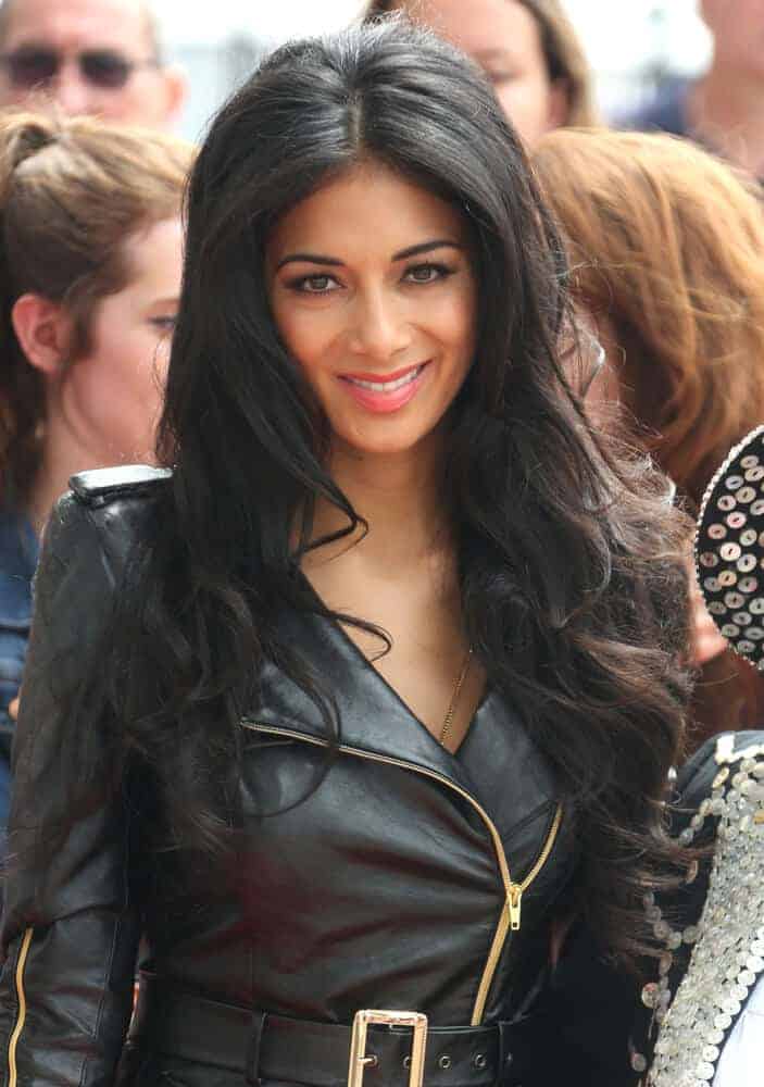 Nicole Scherzinger with center-parted curls went well with her leather outfit she wore during the The X Factor auditions held at London Excel London last June 19, 2013.