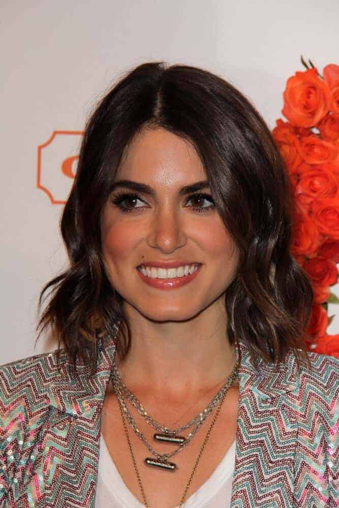 Nikki Reed exhibited a confident and charming personality with her tousled bob as she attended the Coach's 3rd Annual Evening of Cocktails and Shopping, April 10, 2013 in Santa Monica, CA.