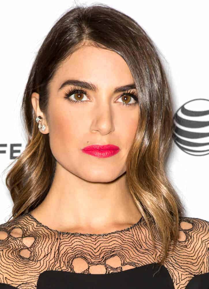 Nikki Reed's black dress went well with her sleek and shiny hairstyle during the premiere of 'Murder of a Cat' at the 2014 Tribeca Film Festival.