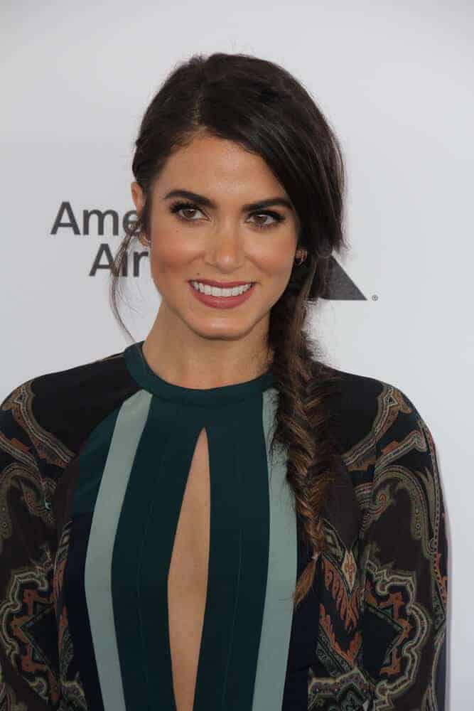 Nikki Reed oozing with charm and grace during the 2016 Film Independent Spirit Awards. She sported a side-swept fishtail braid with a slightly messy finish.