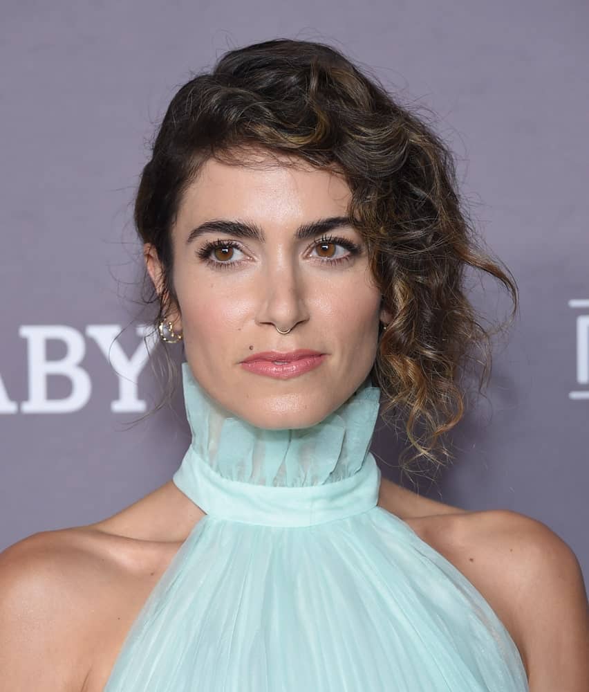 Nikki Reed looking all classy and posh in a pleated halter dress paired with a side-swept updo hairstyle. This look was worn during the 2019 Baby2Baby Gala Presented by Paul Mitchell last November 9th.
