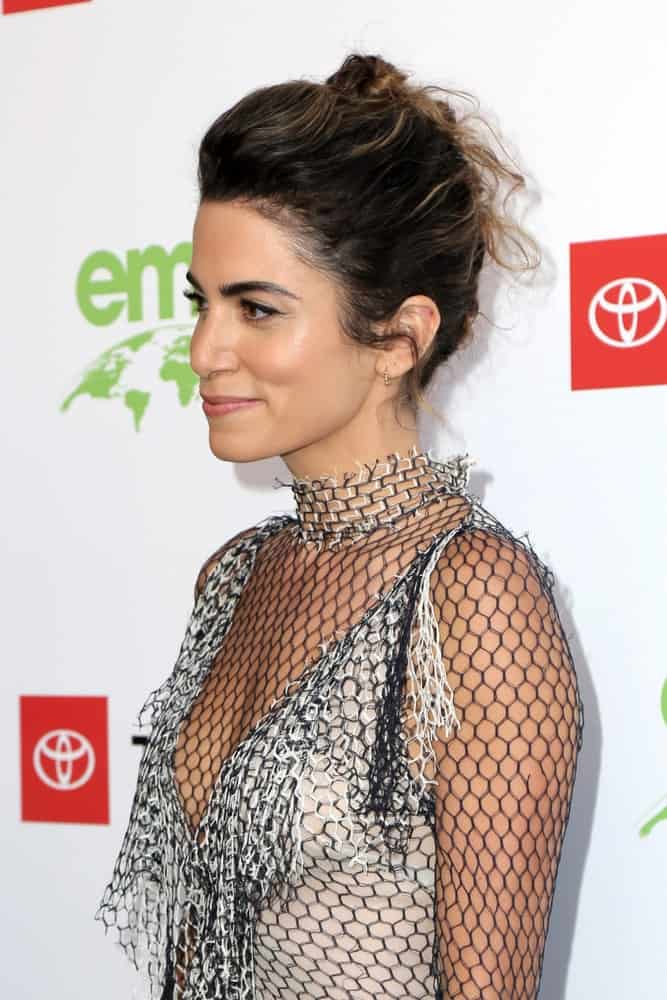 The model sported a long-sleeve netted dress along with a braided updo hairstyle that she wore during the 29th Annual Environmental Media Awards at the Montage Hotel on May 30, 2019.