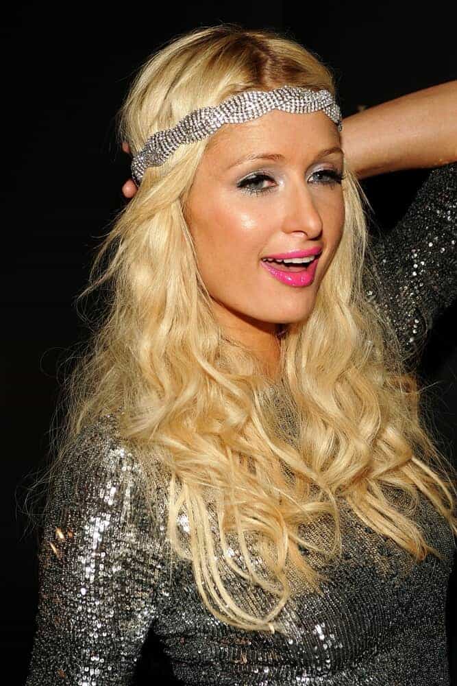 Paris Hilton rocks her loosely curled blonde hair with a silver head band during the Parish Hilton Sunglass Collection Launch Party, October 3, 2009.
