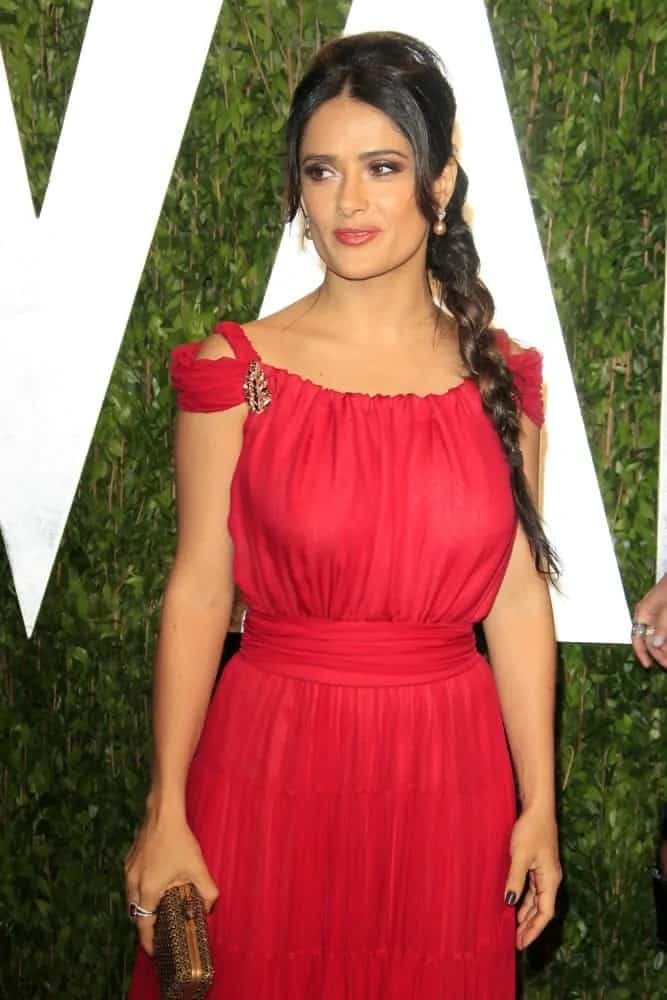Salma Hayek was at the 2012 Vanity Fair Oscar Party last February 26, 2012. She stood out with her gorgeous red dress paired with a braided hairstyle for that simple yet elegant look.