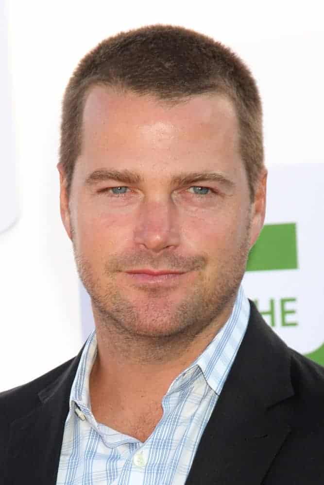 Chris O'Donnell was at the CBS, CW, and Showtime 2012 Summer TCA party at Beverly Hilton Hotel Adjacent Parking Lot on July 29, 2012, in Beverly Hills, CA. He wore a smart-casual jacket with his patterned shirt and short dark brown crew cut.