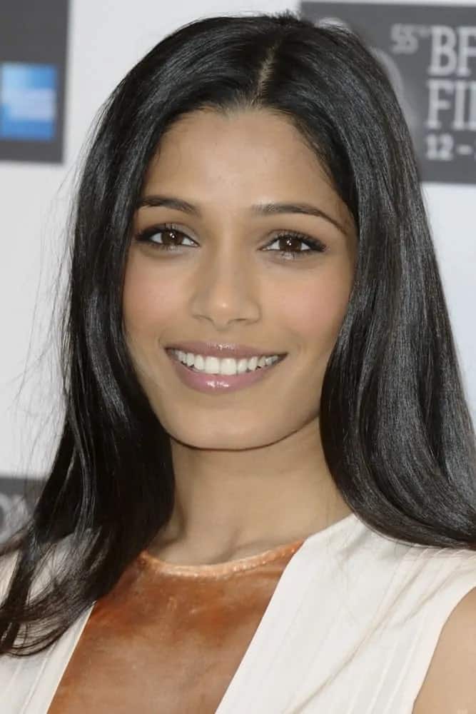 The Indian actress wore her straight raven hair down in sleek and straight loose style at the photocall for "Trishna", as part of the London Film Festival 2011 last October 22, 2011.