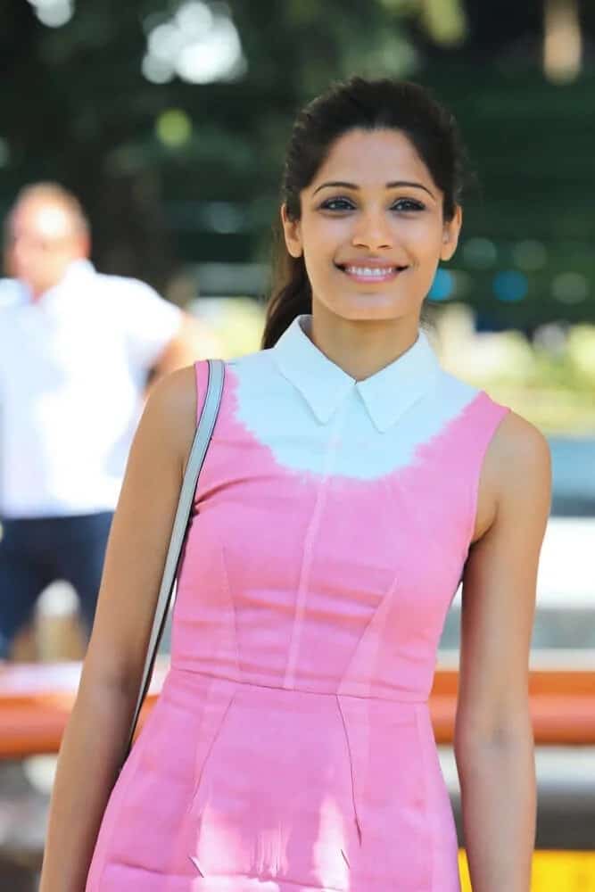 Freida Pinto pulled off a prim and proper look with her simple ponytail and pink summer outfit at the Miu Miu Women's Tales Talks during the 70th Venice Film Festival, August 31, 2013.